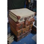 A Collection of Four Various Vintage Leather Mounted Suitcases