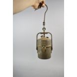 A Vintage Cylindrical Metal Carbide Lamp, Inscribed with Paper Label (Incomplete) but
