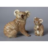 A Beswick Koala Bear No.1038 and a Koala Bear with Fruit No.1040