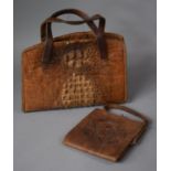 A Vintage Ladies Crocodile Skin Handbag and a Tooled Leather Smaller Example with Embossed