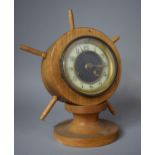 A Novelty Mantle Clock in the Form of a Ships Wheel on Turned Wooden Socle, 28cm high