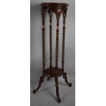 A Modern Mahogany Circular Topped Torchere Stand with Barley Twist Supports and Scrolled Feet, 100cm