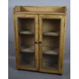 A Stripped Pine Glazed Bookcase with Galleried Top, 65cm wide
