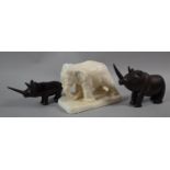 Two Carved African Wooden Rhino Figures and a Plaster Elephant, the Latter 18.5cm Long