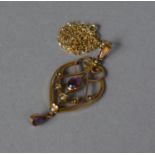 An Edwardian 9ct Gold Pendant Having Amethyst and Seed Pearl Mounts on a 9ct Gold Chain