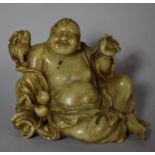 A Carved Chinese Soapstone Study of Reclining Immortal with Smiling Face, 8cm high