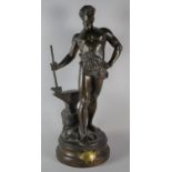 A Large French Bronze Figure of a Blacksmith at His Anvil, Brass Plaque Inscribed "Le Travail, Par M