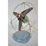 A Vintage Pifco Metal Table Top Fan with Guard (AF), 29cm high