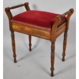 A Late Victorian/Edwardian Walnut Piano Stool on Turned Supports, 57cm wide