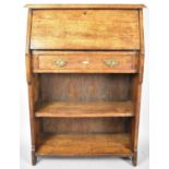 An Edwardian Oak Hall Bureau with Centre Drawer and Open Bookcase Base, 74cm wide