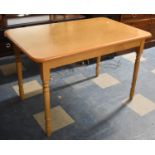 A Modern Rectangular Kitchen Table on Turned Supports, 121cm Long