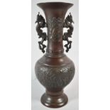A Japanese Meiji Period Bronze Two Handled Vase, the Body Decorated in Relief with Emperor and