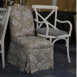 A Painted Bentwood Cane Seated Armchair and an Upholstered Nursing Chair