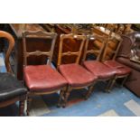 A Set of Four Oak Framed Dining Chairs with Maltese Cross Decoration to Backs, in Need of