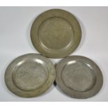 A Collection of Three Early Pewter Plates, the Largest 24.5cm Diameter