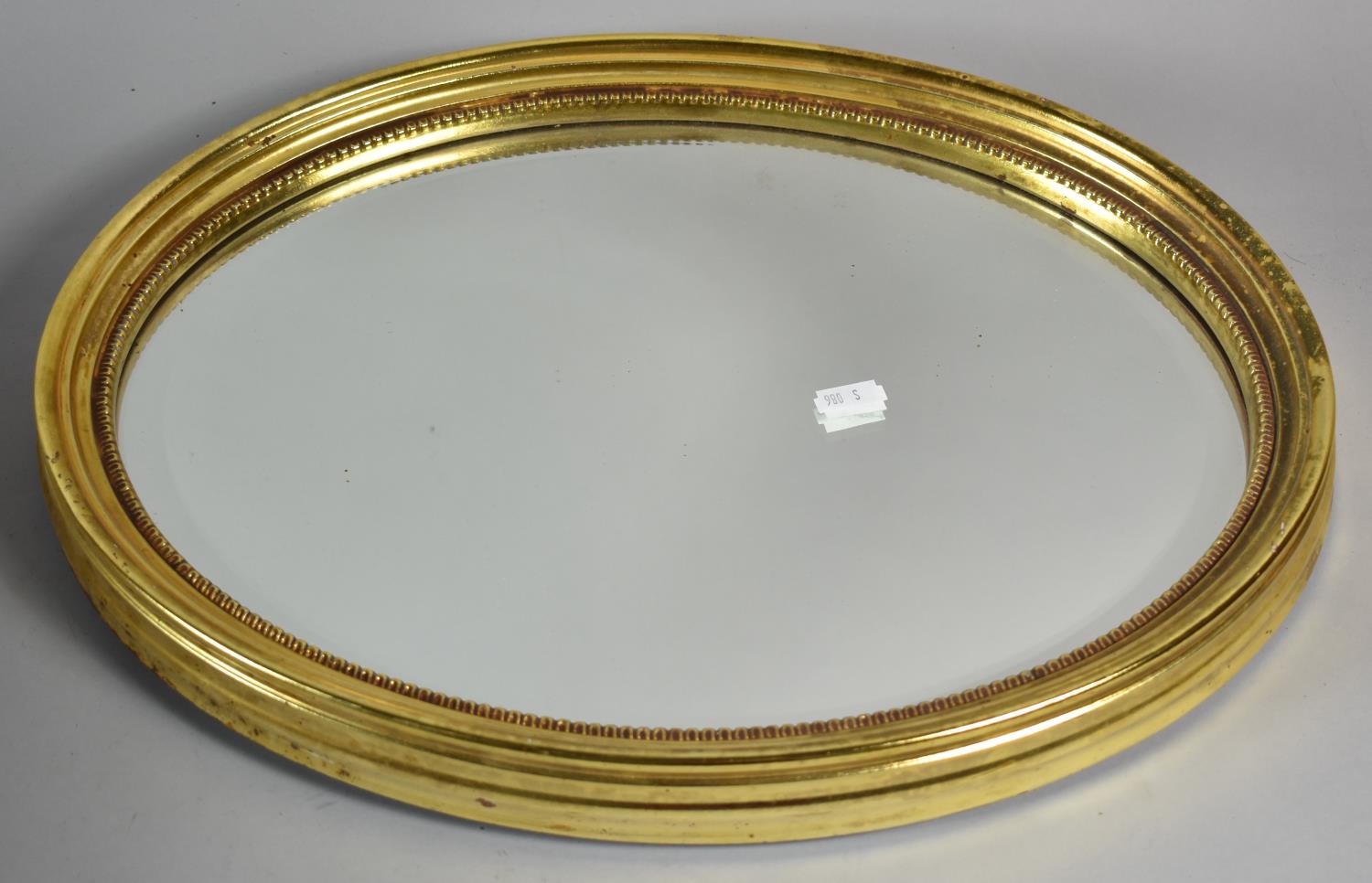 A Small Oval Gilt Framed Wall Mirror, 33cm Wide