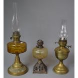 A Collection of Three Late 19th/Early 20th Century Brass, Iron and Glass Oil Lamps