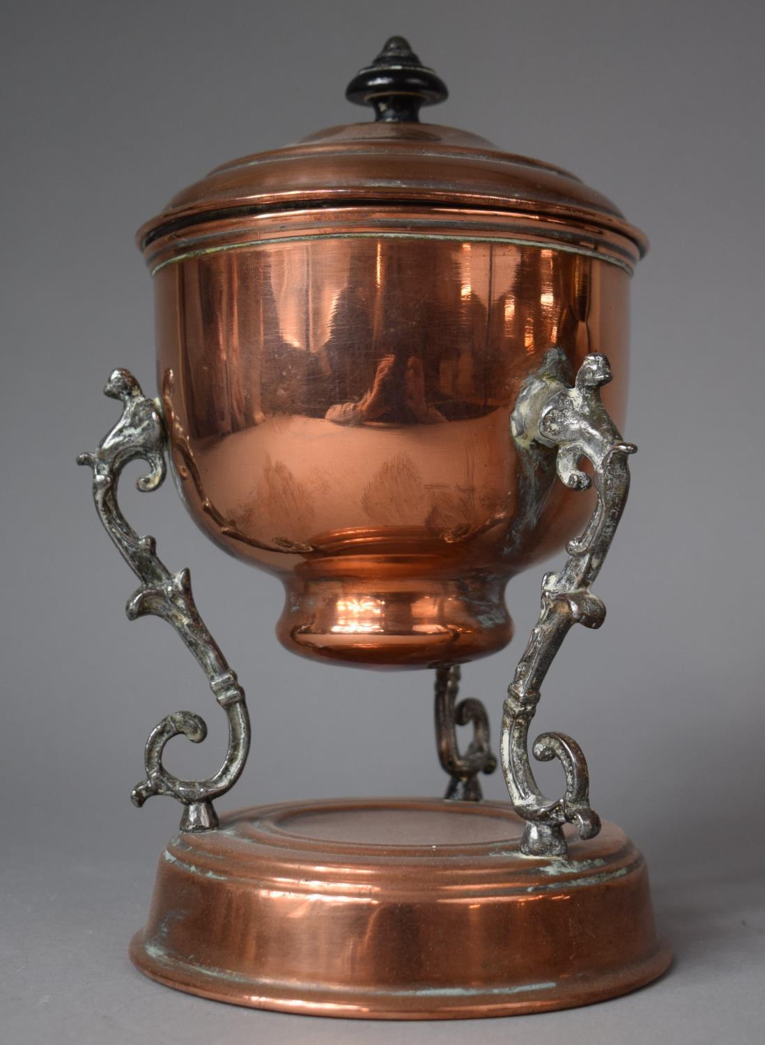 A Copper Lidded Pot on Silver Plated Tripod Scrolled and Pierced Supports, Plinth Base, 21.5cm high