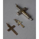 Two Silver Crucifix Pendants Together with a White Metal Example Housing Religious Artifact