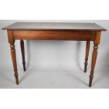 A Mahogany String Inlaid Rectangular Side Table on Turned Supports, 108cm wide