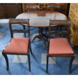 An Oval Mahogany Tripod Dining Table Together with Four Dining Chairs, Table 114cm Long