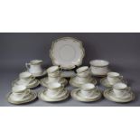 An Edwardian Gilt and Floral Pattern Teaset to Include Ten Cups, One Slop Bowl, Milk Jug, Eleven