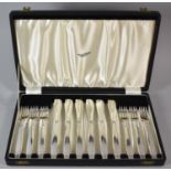A Cased Set of Six Stainless Steel Fish Knives and Forks