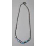 A Silver and Turquoise Sectional Necklace with Five Stones, 42.5cm Long 28.2g
