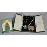 Two Necklaces with Lion and Elephant Pendants Together with a Vintage Bottle of Eau De Cologne