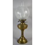 A Vintage Brass Oil Lamp with Etched Globe