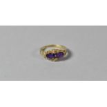 A 9ct Gold Ring Set with Two Amethysts and Four Diamond Chips, London Hallmark, Size K1/2, 2.2g