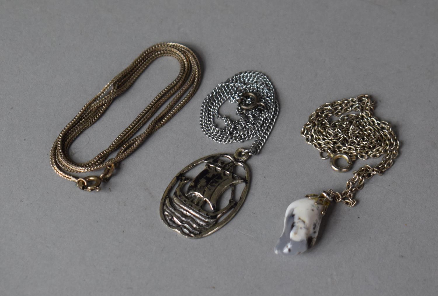Three Necklaces and Two Pendants