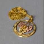 A Gold Pendant with Vine and Grape Decoration in a Circular Design, Stamped 10k to Chain, 2.3g