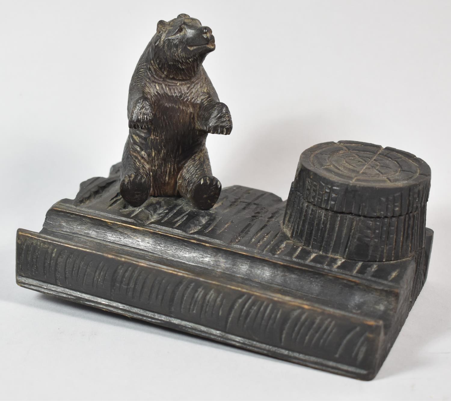 A Carved Black Forest Novelty Inkstand in the Form of Seated Bear Beside Tree Stump, with Original