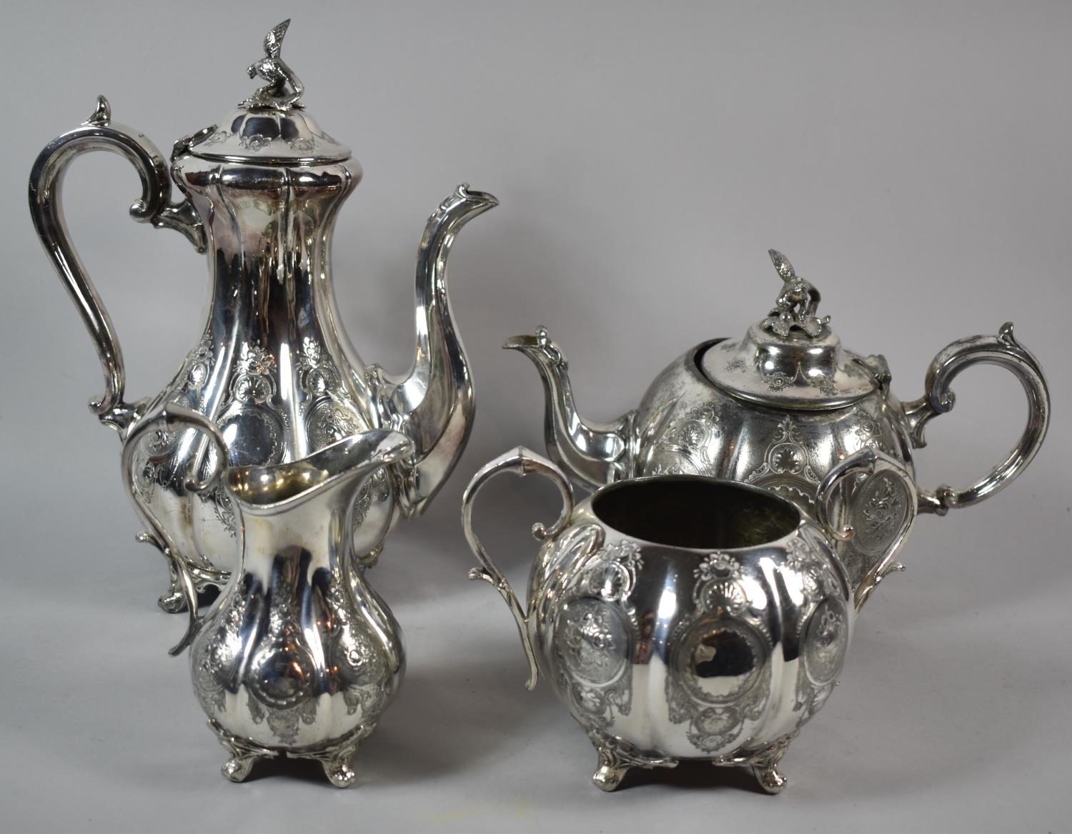 A Four Piece Silver Plated Teaservice, Teapot with Loss to Two Feet