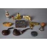 A Collection of Curios to Include Celluloid Figure Groups and Animals, Vintage Pipes, Novelty Bottle