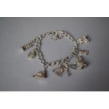 A Silver Charm Bracelet with Eight Charms, Stamped Sterling