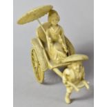 A Small Mid 20th Century Japanese Celluloid Rickshaw Figure