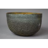 A Far Eastern Intricately Etched White Metal Bowl with Verdigris Finish, Decorated in Relief with