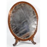 An Edwardian Mahogany Framed Oval Dressing Table Mirror with Easel Back and Two Scrolling
