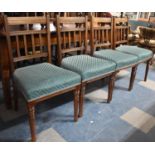 A Set of Four Edwardian Dining Chairs with Upholstered Seats