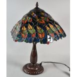 A Reproduction Bronze Effect Table Lamp with Tiffany Style Shade, 45cm high