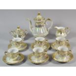A Gilt and 'Mother of Pearl' Glazed Lustre Coffee Set Comprising Six Cans, Six Saucers, Lidded