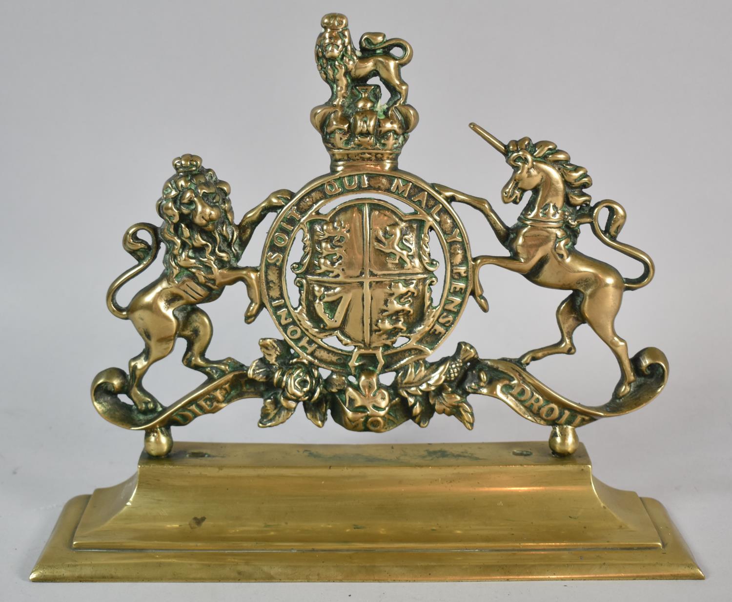 A Brass Royal Crest Set on Plinth Base, 31cm wide