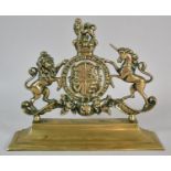 A Brass Royal Crest Set on Plinth Base, 31cm wide