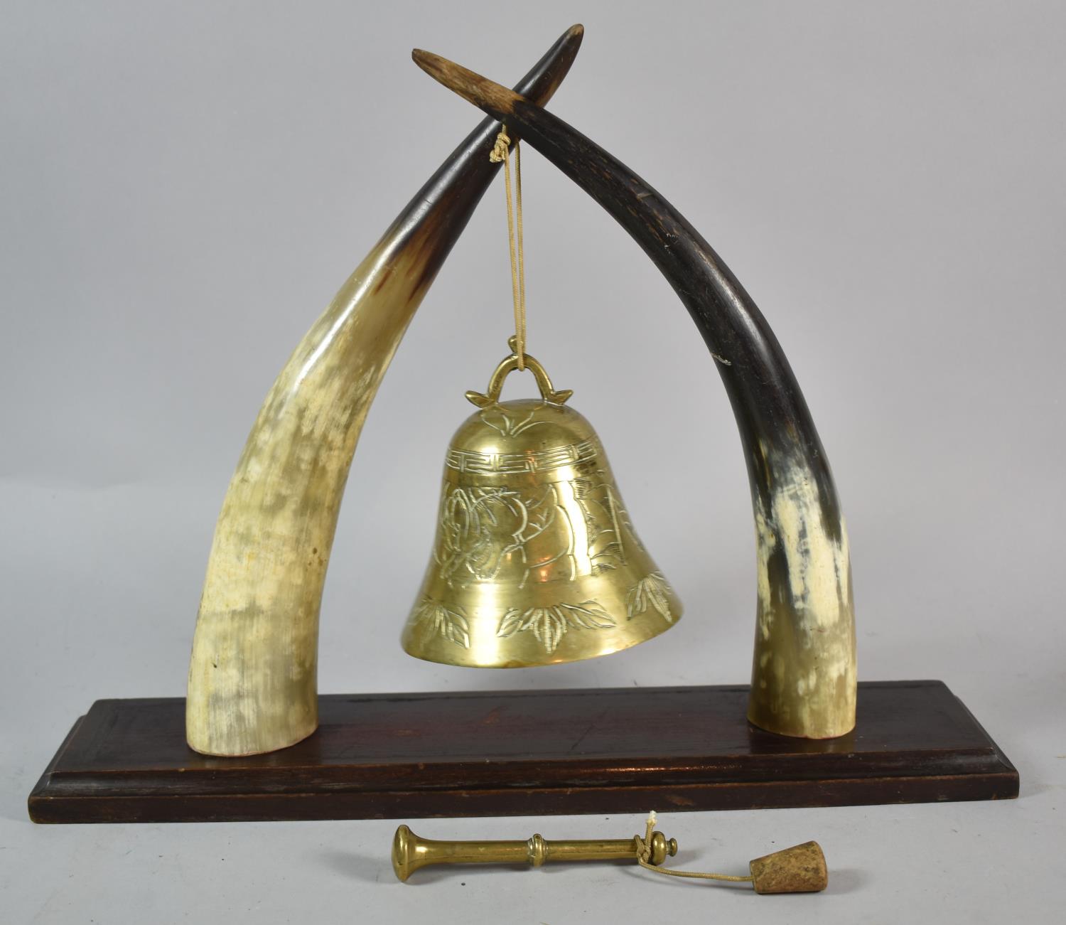 An Early 20th Century Novelty Dinner Gong Formed from Horns with Far Eastern Bell and Clapper,