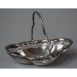 A Pierced and Lobed Silver Bonbon Dish with Hinged Handle, 12cm wide, 50.6g AF