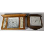 An Edwardian Oak Wall Hanging Weather Station, 32cm wide and a Similar Aneroid Barometer, 22cm wide