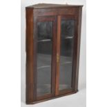 A Mid 20th Century Mahogany Wall Hanging Glazed Corner Cupboard with Two Inner Shaped Shelves,