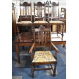 A Set of Four Edwardian Oak Framed Dining Chairs to Include One Carver, Barley Twist Supports,